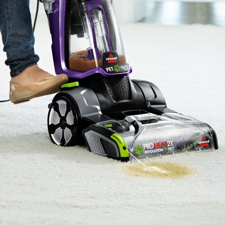 Someone vacuuming a carpeted home showcasing which vacuums are best for cleaning carpets. Links to a blog post about which vacuums are best for carpeted floors. 